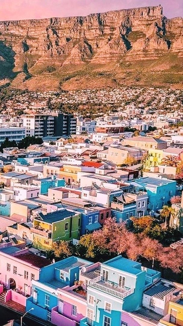 Colorful Bo-Kaap neighborhood houses with Table Mountain in the background, Cape Town, South Africa